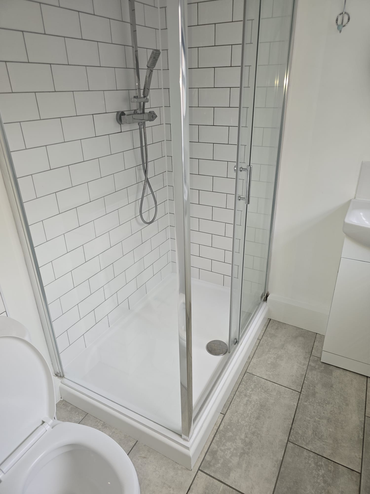 Shower enclosure after cleaning during a void turnaround