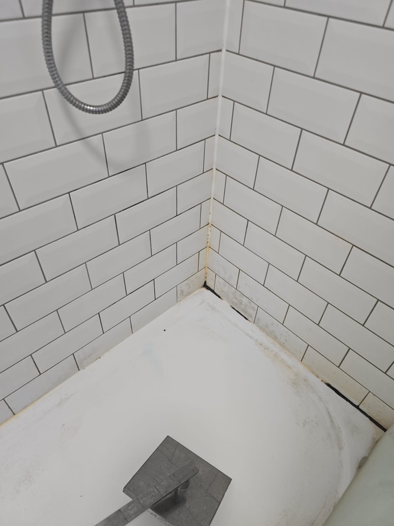 Shower enclosure before cleaning during a void turnaround